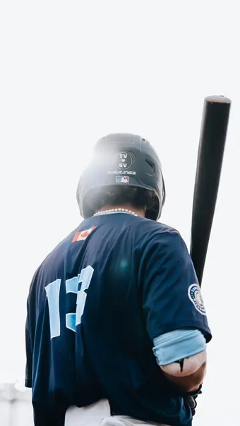 Picture of batter stepping up to the plate