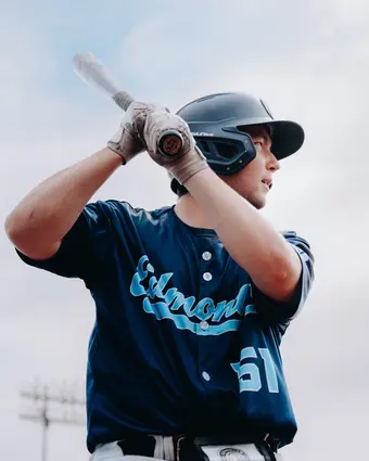 Baseball player batting wearing number 51