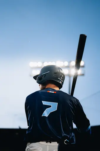 Baseball player batting wearing number 7
