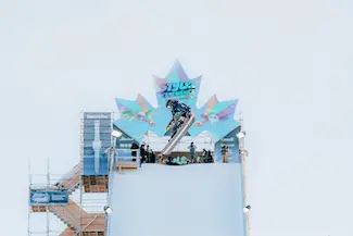 Snowboarder photographed mid jump