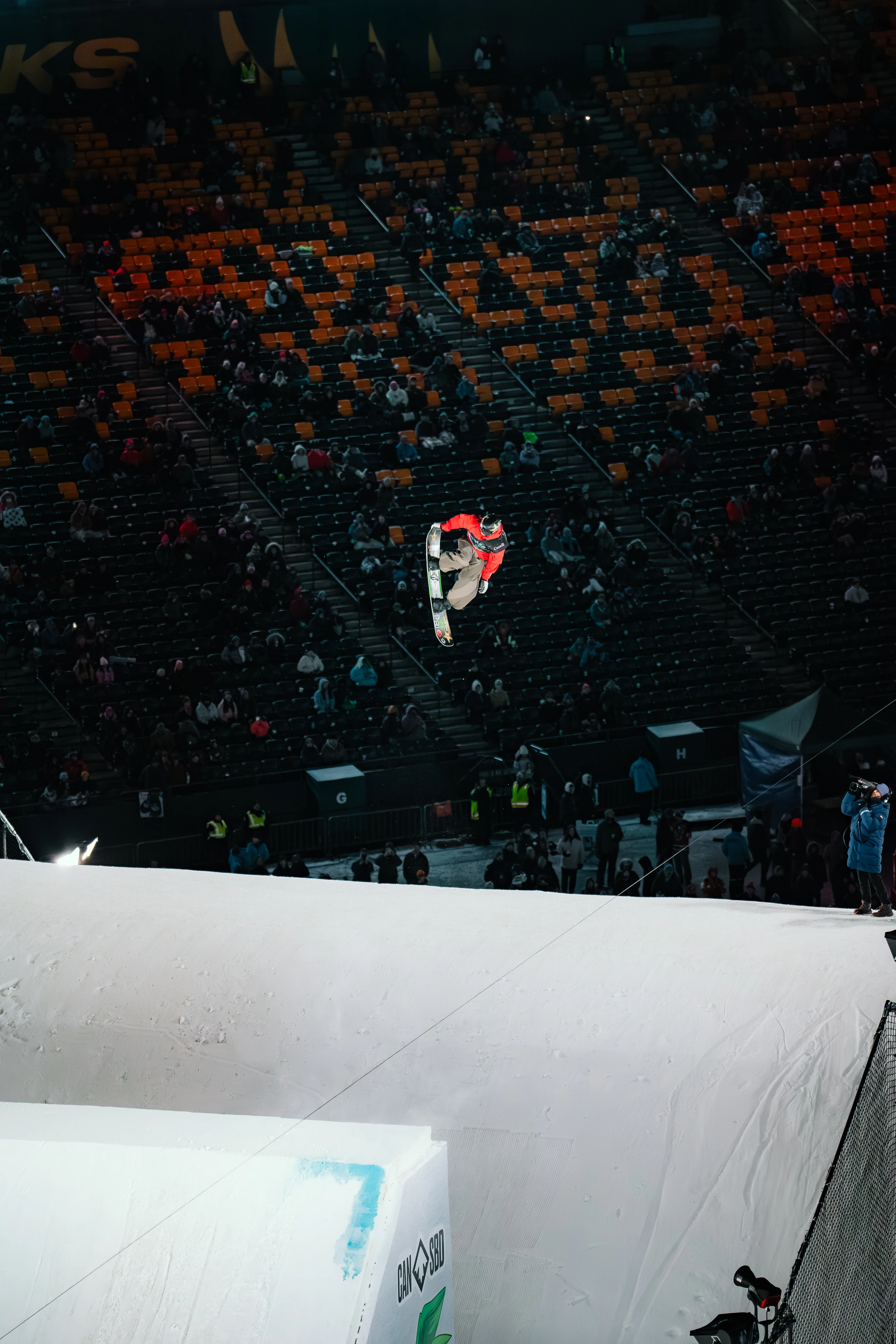 Snowboarder mid flight off a jump