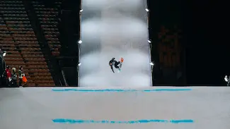 Snowboarder photographed mid flight