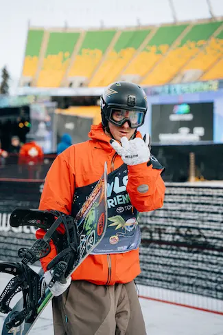 Snowboarder posing for picture