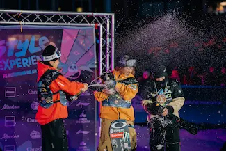 3 podium winners celebrating