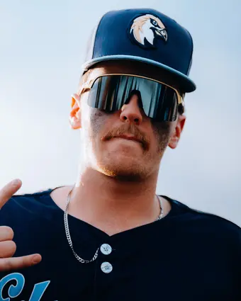 Baseball player with blue shades and chain