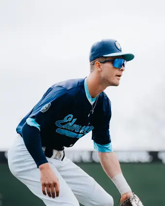 Baseball player with blue shades and hat