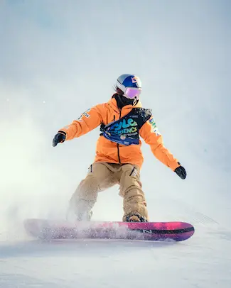 Snowboard leaning on back edge of board