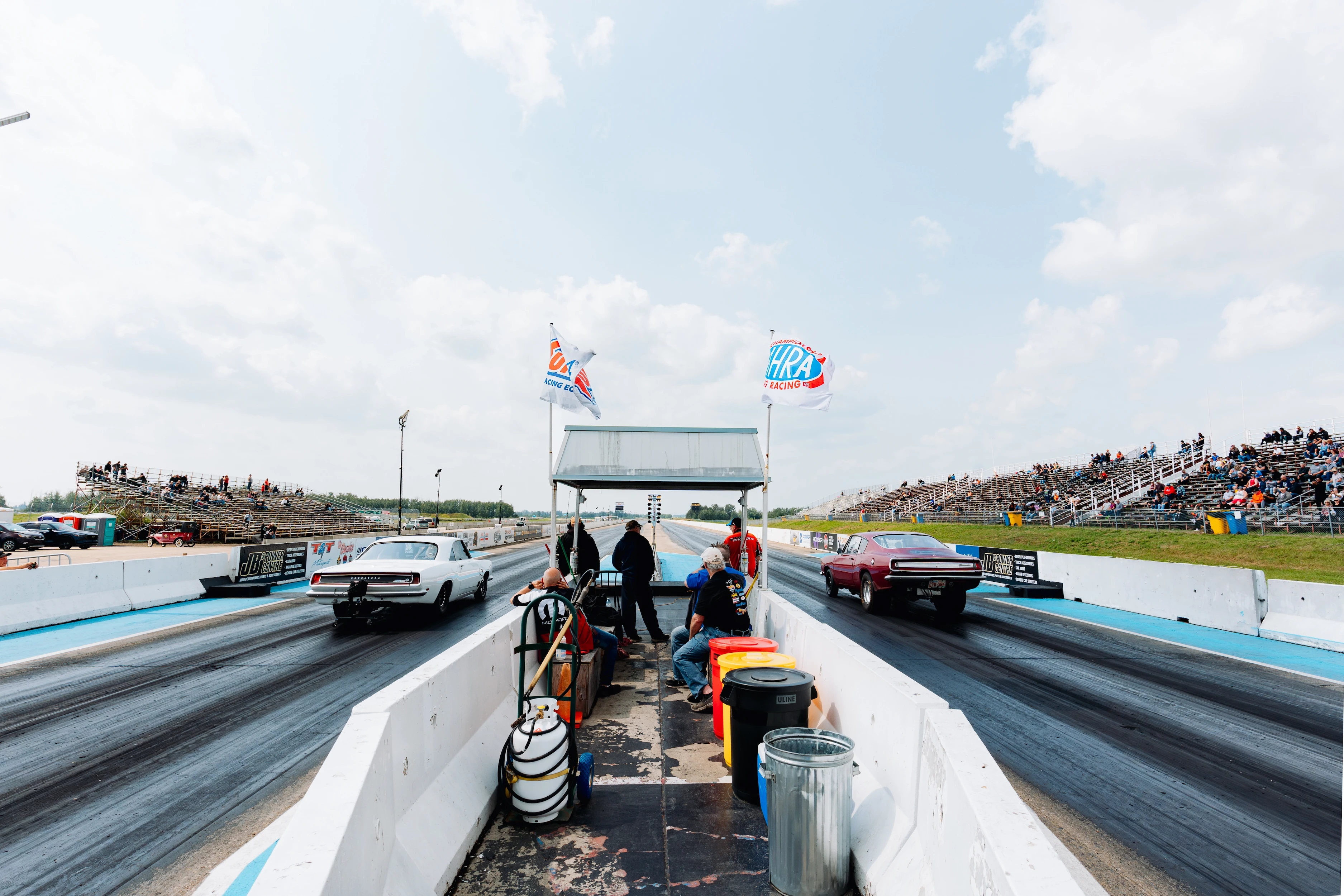 Photo of two cars ready to drag race